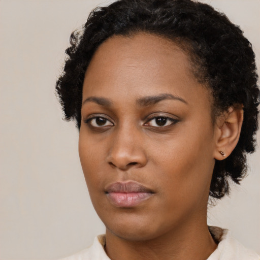 Neutral black young-adult female with short  black hair and brown eyes
