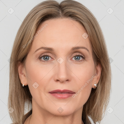 Joyful white adult female with medium  brown hair and grey eyes