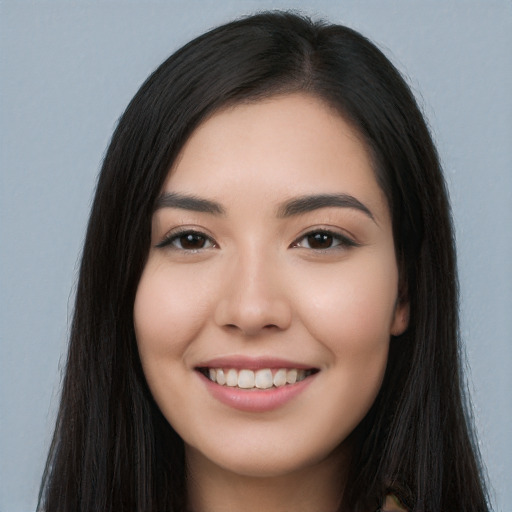 Joyful white young-adult female with long  black hair and brown eyes