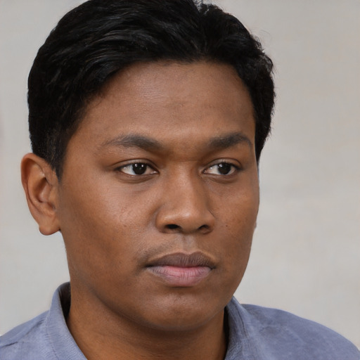 Neutral black young-adult male with short  brown hair and brown eyes