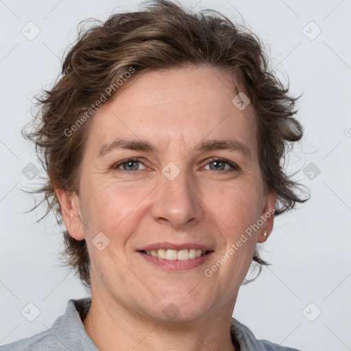 Joyful white adult female with short  brown hair and grey eyes