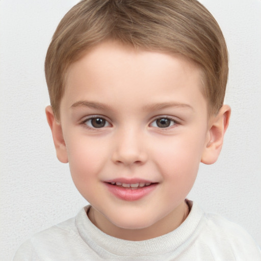 Joyful white child male with short  brown hair and brown eyes