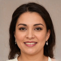 Joyful white young-adult female with medium  brown hair and brown eyes