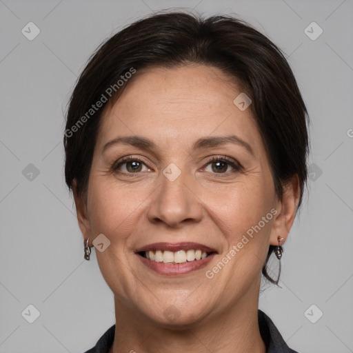 Joyful white adult female with medium  brown hair and brown eyes