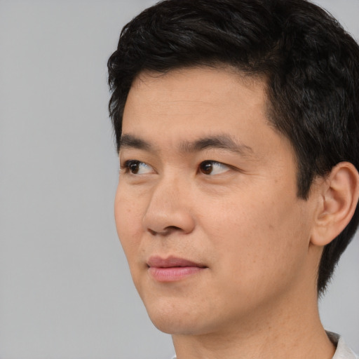Neutral asian young-adult male with short  black hair and brown eyes