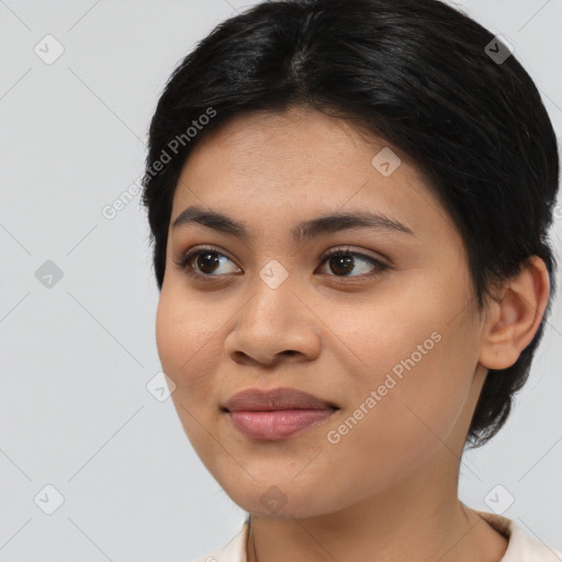 Joyful asian young-adult female with medium  black hair and brown eyes