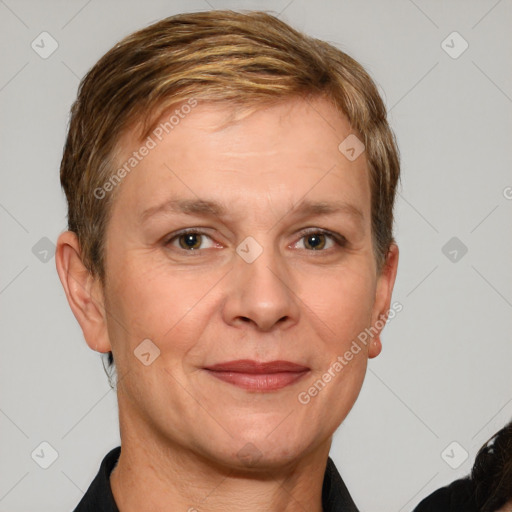 Joyful white adult female with short  brown hair and grey eyes