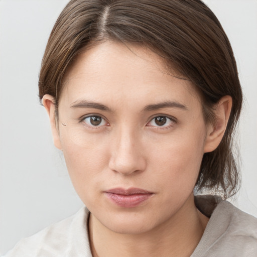 Neutral white young-adult female with medium  brown hair and brown eyes