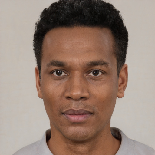 Neutral black young-adult male with short  black hair and brown eyes