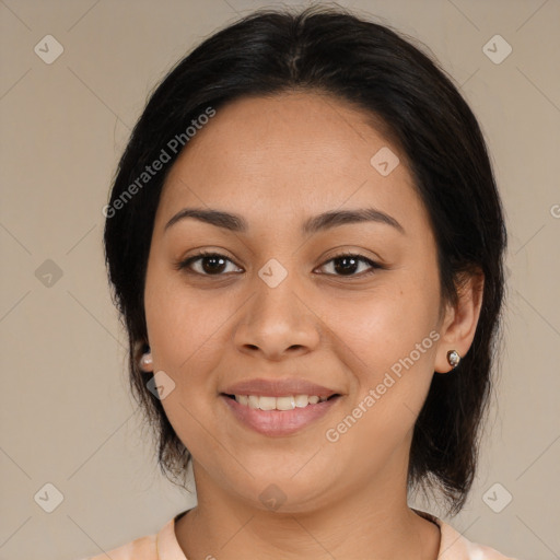 Joyful latino young-adult female with medium  brown hair and brown eyes