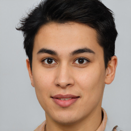 Joyful asian young-adult male with short  brown hair and brown eyes