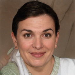 Joyful white adult female with short  brown hair and brown eyes