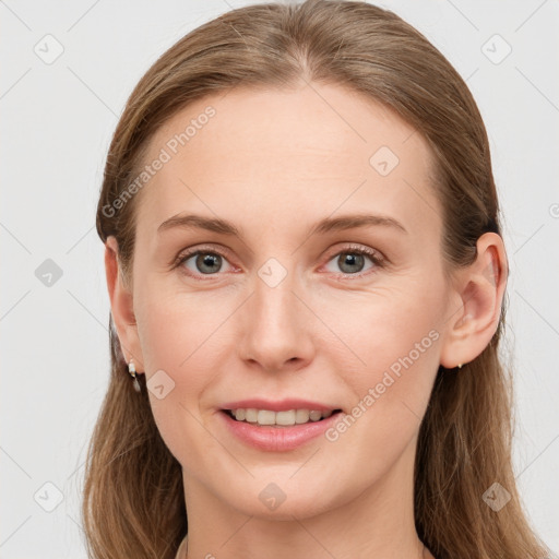 Joyful white young-adult female with long  brown hair and grey eyes