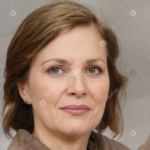 Joyful white adult female with medium  brown hair and grey eyes