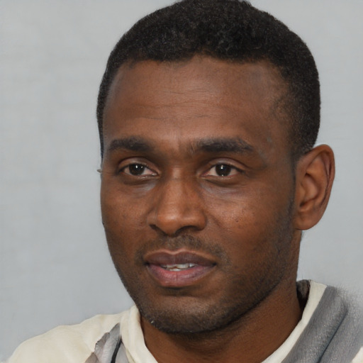 Neutral black young-adult male with short  black hair and brown eyes