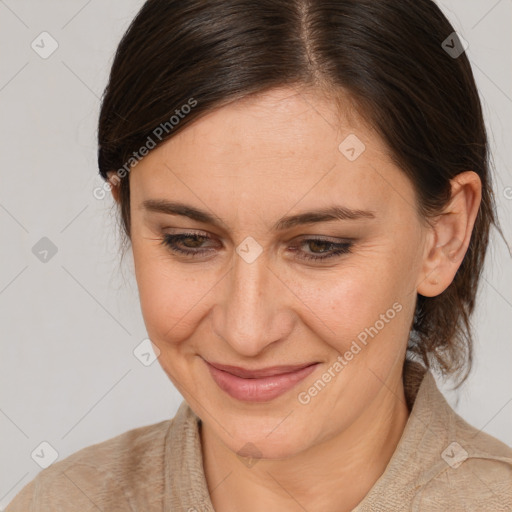 Joyful white adult female with medium  brown hair and brown eyes