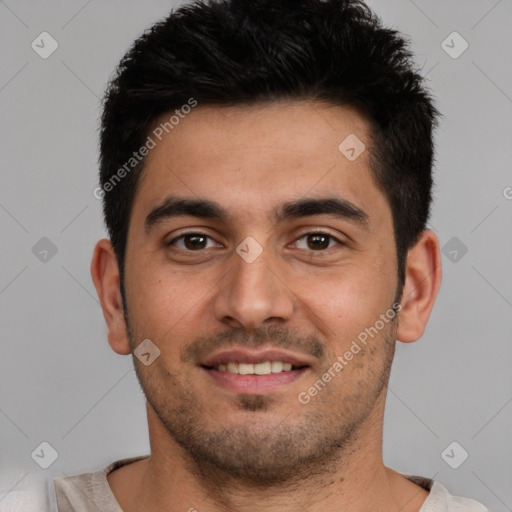 Joyful white young-adult male with short  black hair and brown eyes