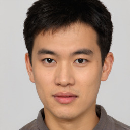 Neutral asian young-adult male with short  brown hair and brown eyes