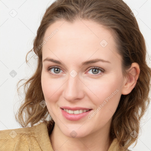 Joyful white young-adult female with medium  brown hair and blue eyes