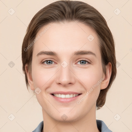 Joyful white young-adult female with medium  brown hair and grey eyes