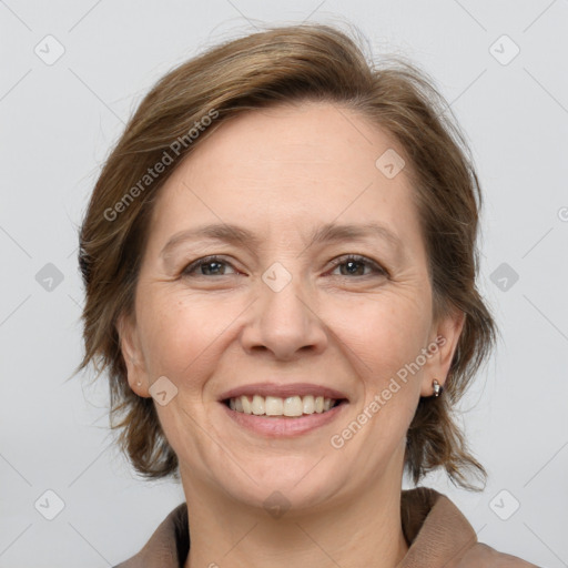 Joyful white adult female with medium  brown hair and brown eyes