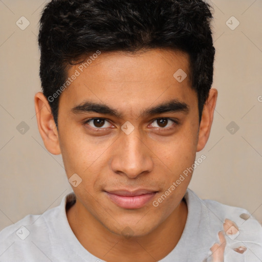 Joyful latino young-adult male with short  brown hair and brown eyes