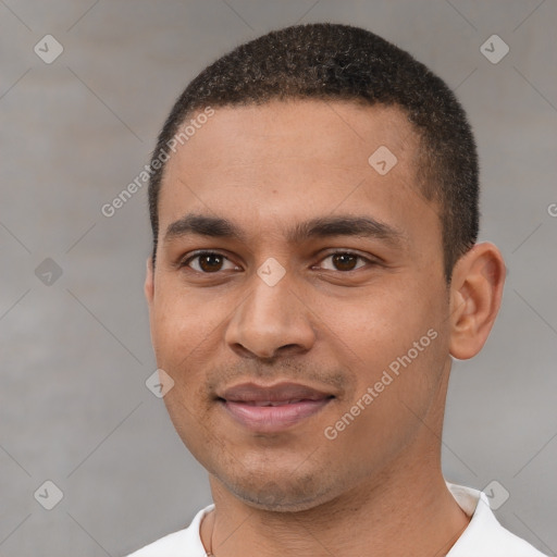 Joyful white young-adult male with short  black hair and brown eyes