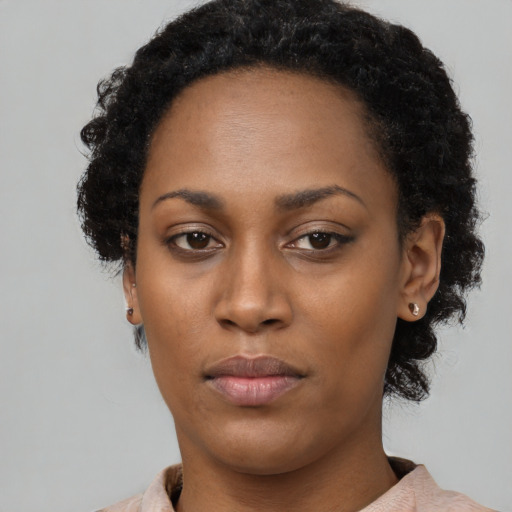 Neutral black young-adult female with short  black hair and brown eyes
