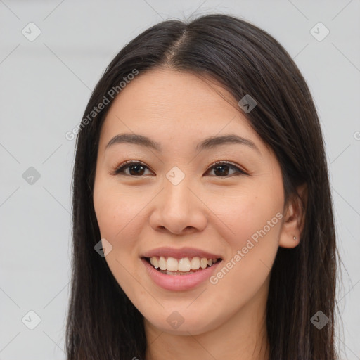 Joyful white young-adult female with long  brown hair and brown eyes