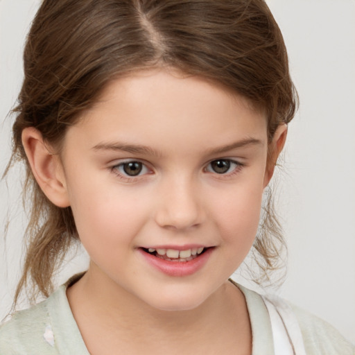 Joyful white child female with medium  brown hair and brown eyes