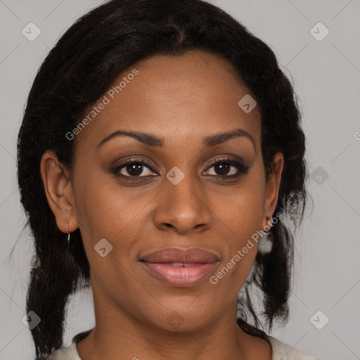 Joyful black adult female with medium  brown hair and brown eyes