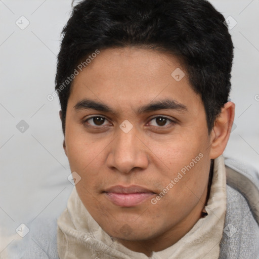 Neutral latino young-adult male with short  brown hair and brown eyes