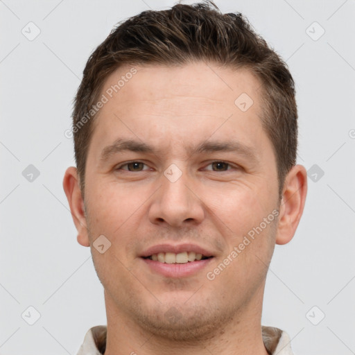 Joyful white young-adult male with short  brown hair and brown eyes