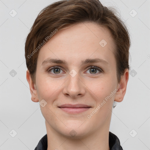 Joyful white young-adult female with short  brown hair and grey eyes