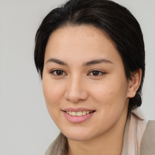 Joyful white young-adult female with medium  brown hair and brown eyes