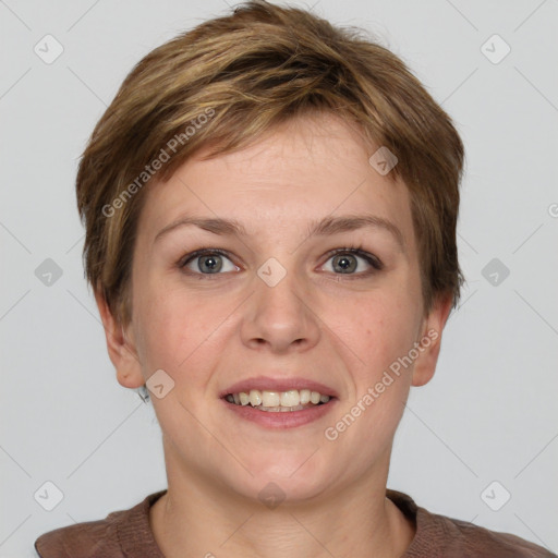 Joyful white young-adult female with short  brown hair and grey eyes