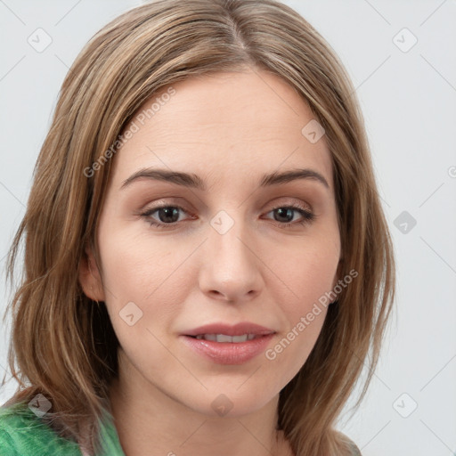 Joyful white young-adult female with long  brown hair and green eyes