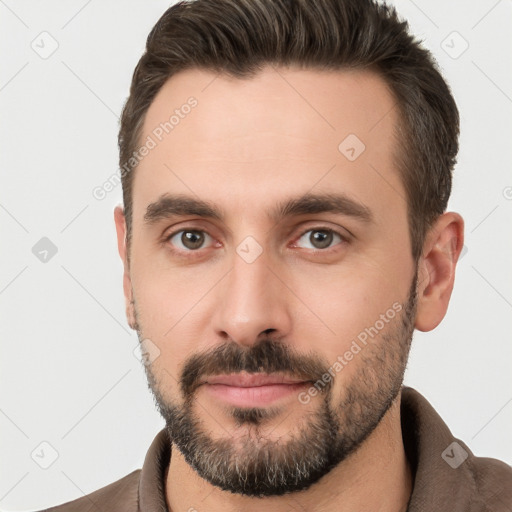 Neutral white young-adult male with short  brown hair and brown eyes