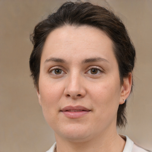 Joyful white young-adult female with medium  brown hair and brown eyes