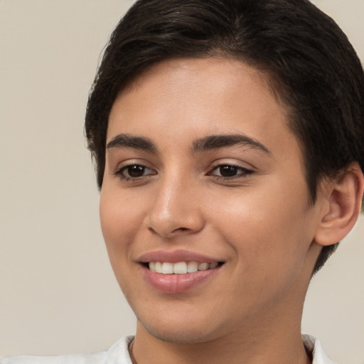 Joyful white young-adult female with short  brown hair and brown eyes