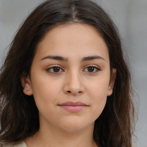 Neutral white young-adult female with long  brown hair and brown eyes