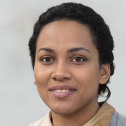 Joyful latino young-adult female with medium  black hair and brown eyes