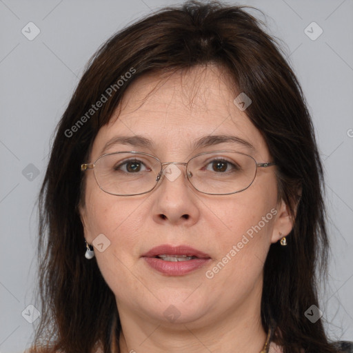 Joyful white adult female with medium  brown hair and brown eyes