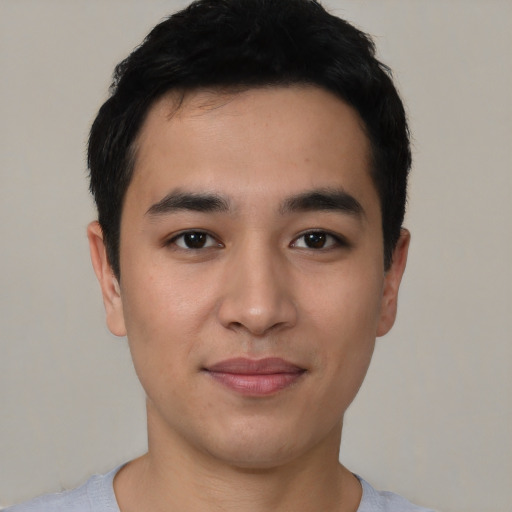 Joyful asian young-adult male with short  black hair and brown eyes