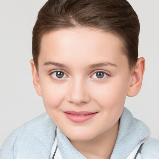 Joyful white child female with short  brown hair and brown eyes