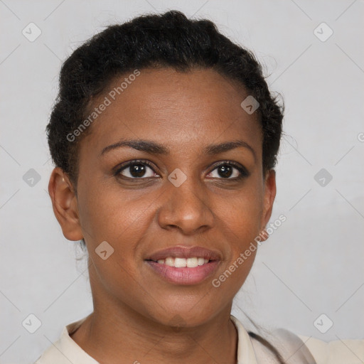 Joyful black young-adult female with short  brown hair and brown eyes