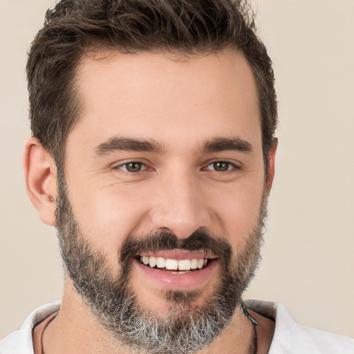 Joyful white young-adult male with short  black hair and brown eyes