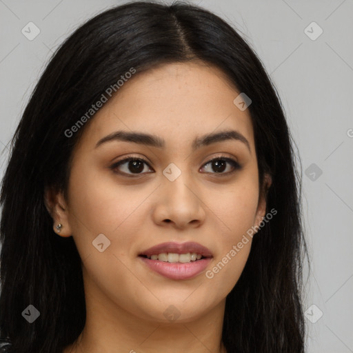 Joyful latino young-adult female with long  brown hair and brown eyes