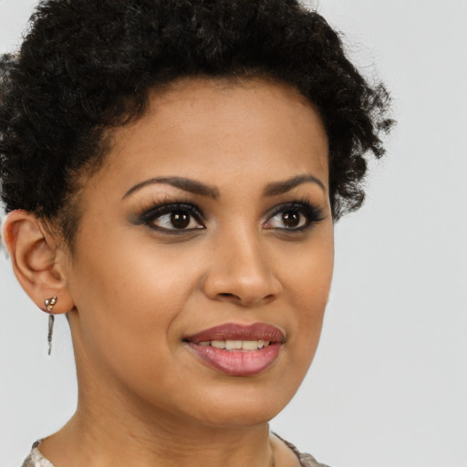 Joyful latino young-adult female with short  brown hair and brown eyes