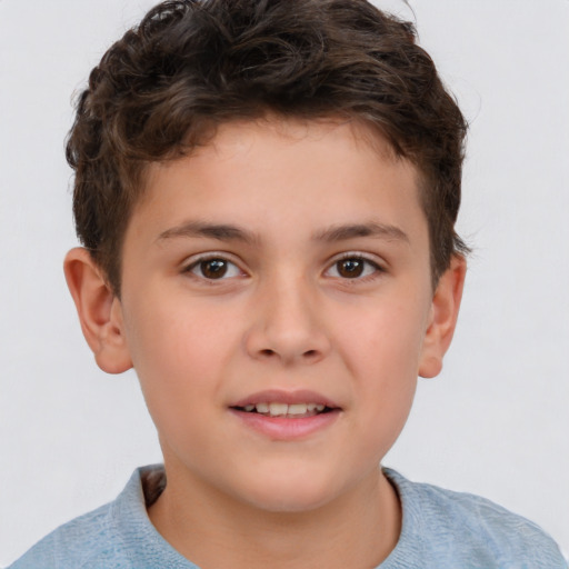 Joyful white child male with short  brown hair and brown eyes